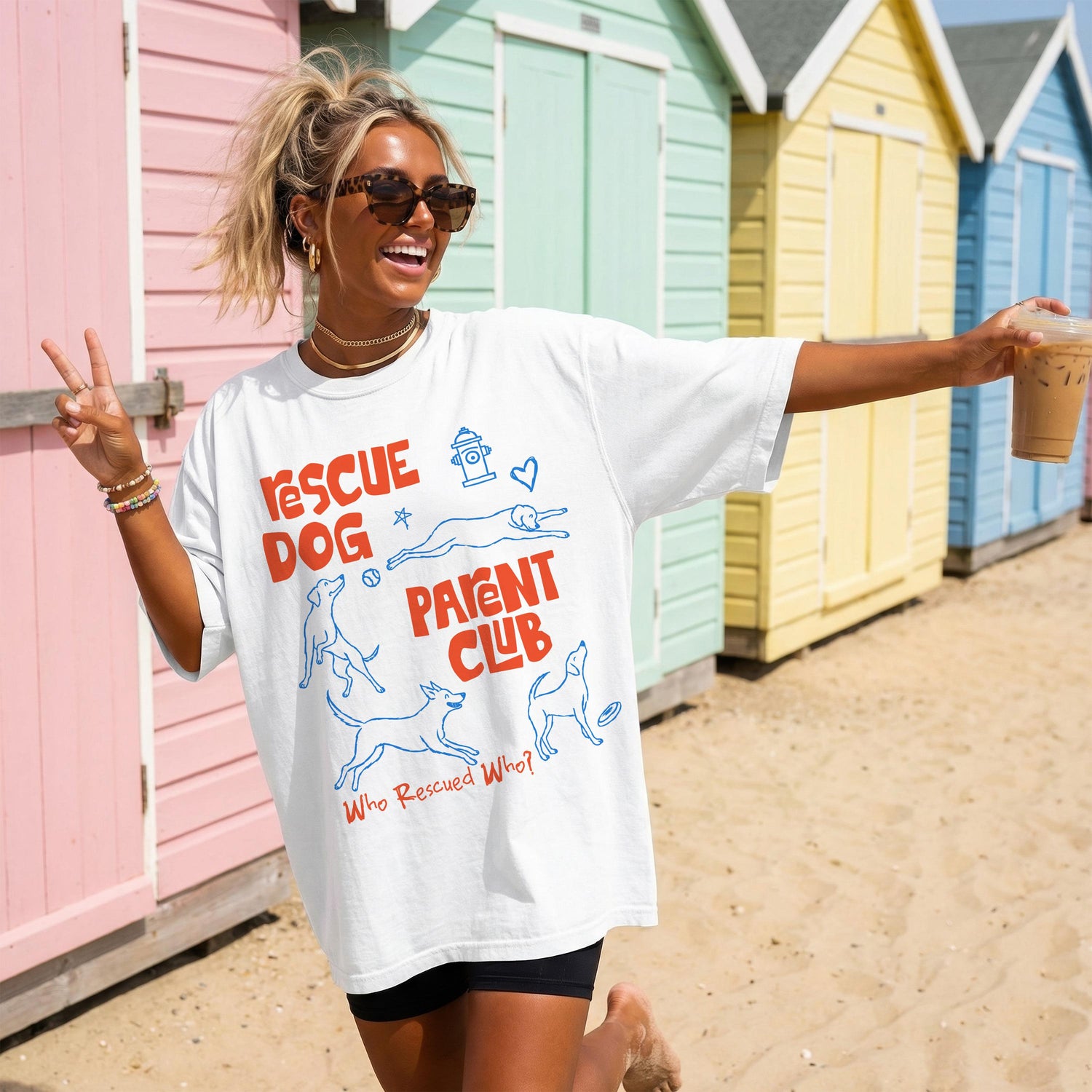White t-shirt with &amp;quot;Rescue Dog Parent Club&amp;quot; text and dog graphics.