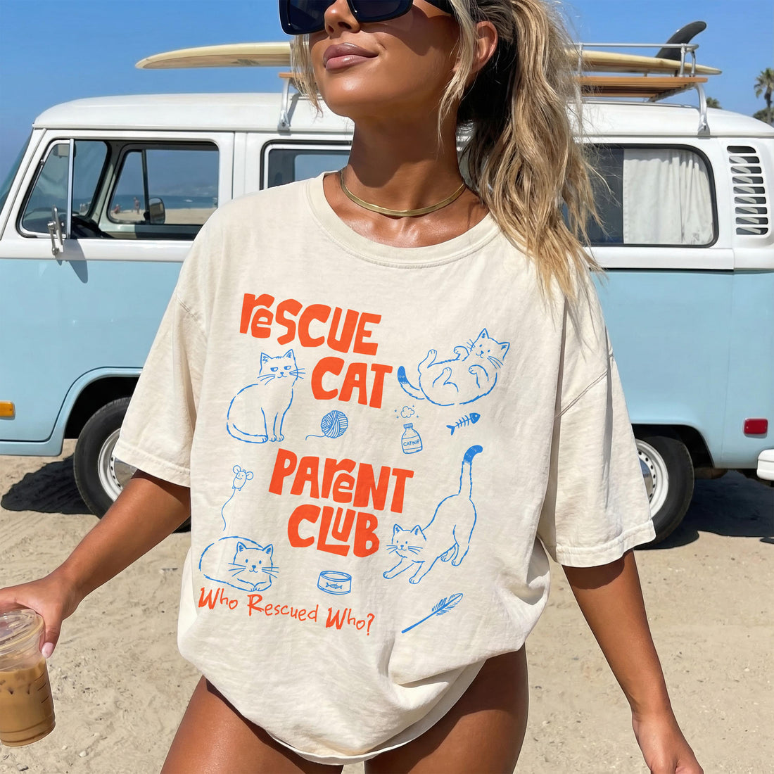 Cream t-shirt with &amp;quot;Rescue Cat Parent Club&amp;quot; text and cat illustrations.