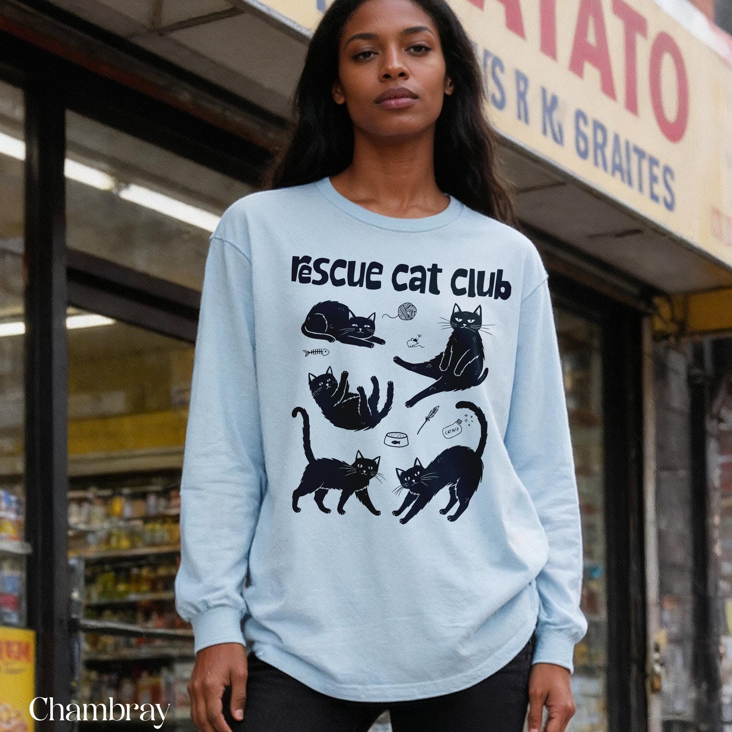 Light blue long-sleeve shirt with &amp;quot;Rescue Cat Club&amp;quot; and cat graphic designs.
