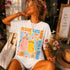 Woman wearing graphic tee with two cats and "Know Who&