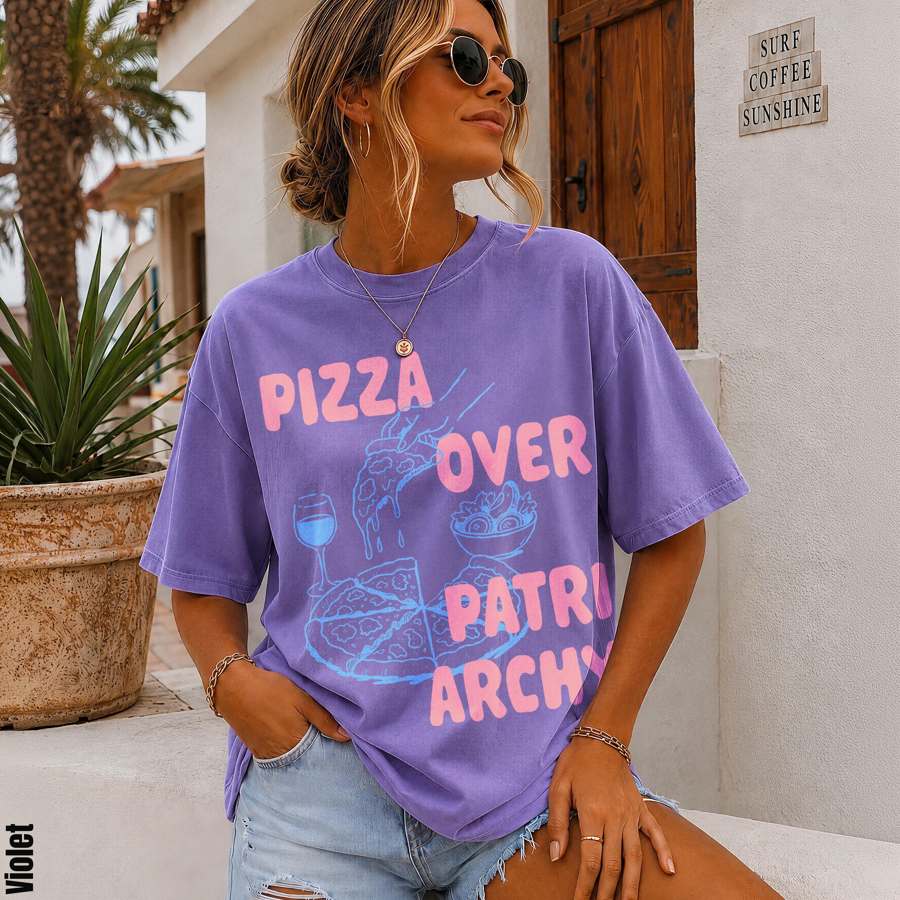 Purple t-shirt with &amp;quot;Pizza Over Patriarchy&amp;quot; graphic for women.