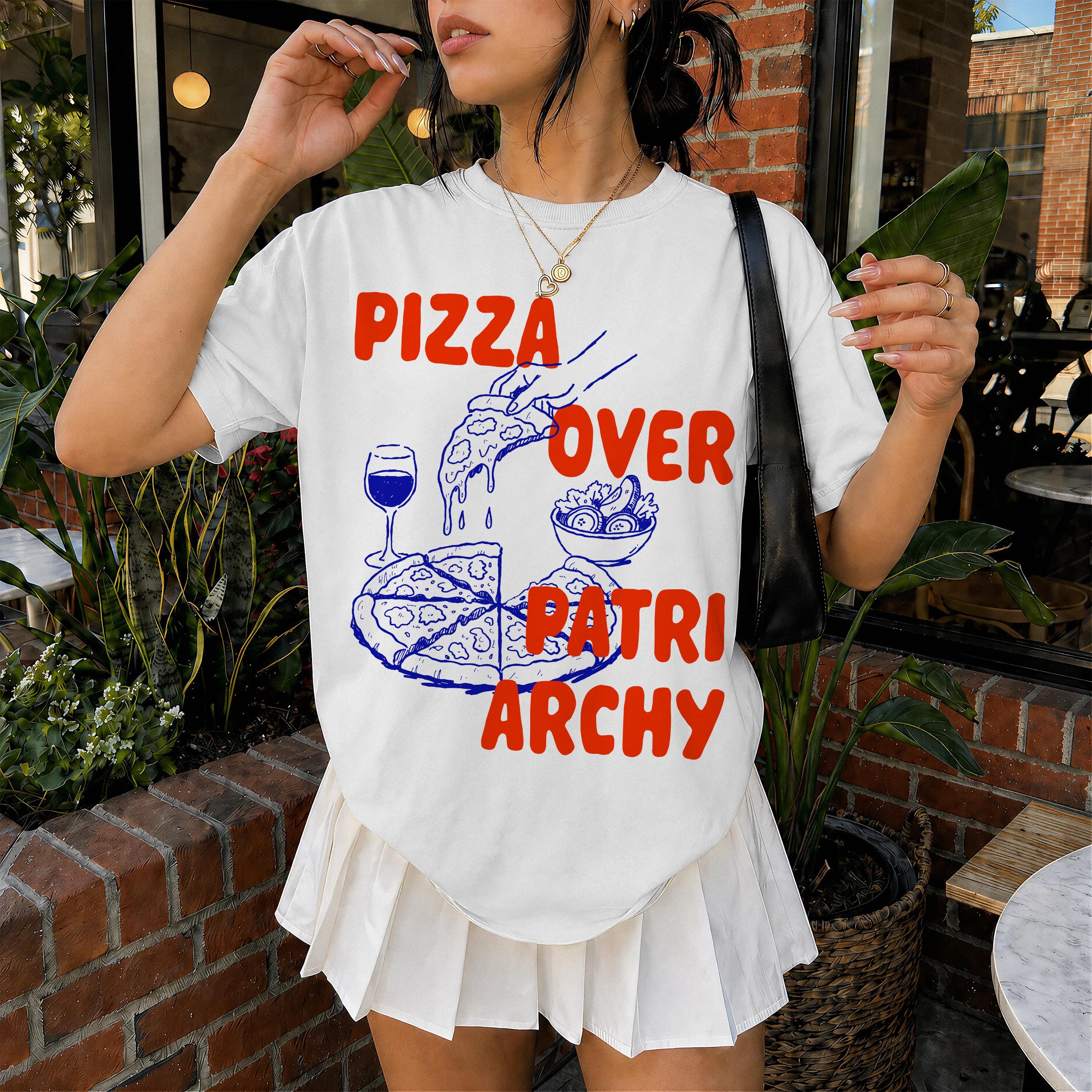 White t-shirt with red text &amp;quot;Pizza Over Patriarchy&amp;quot; and a drawing of pizza.