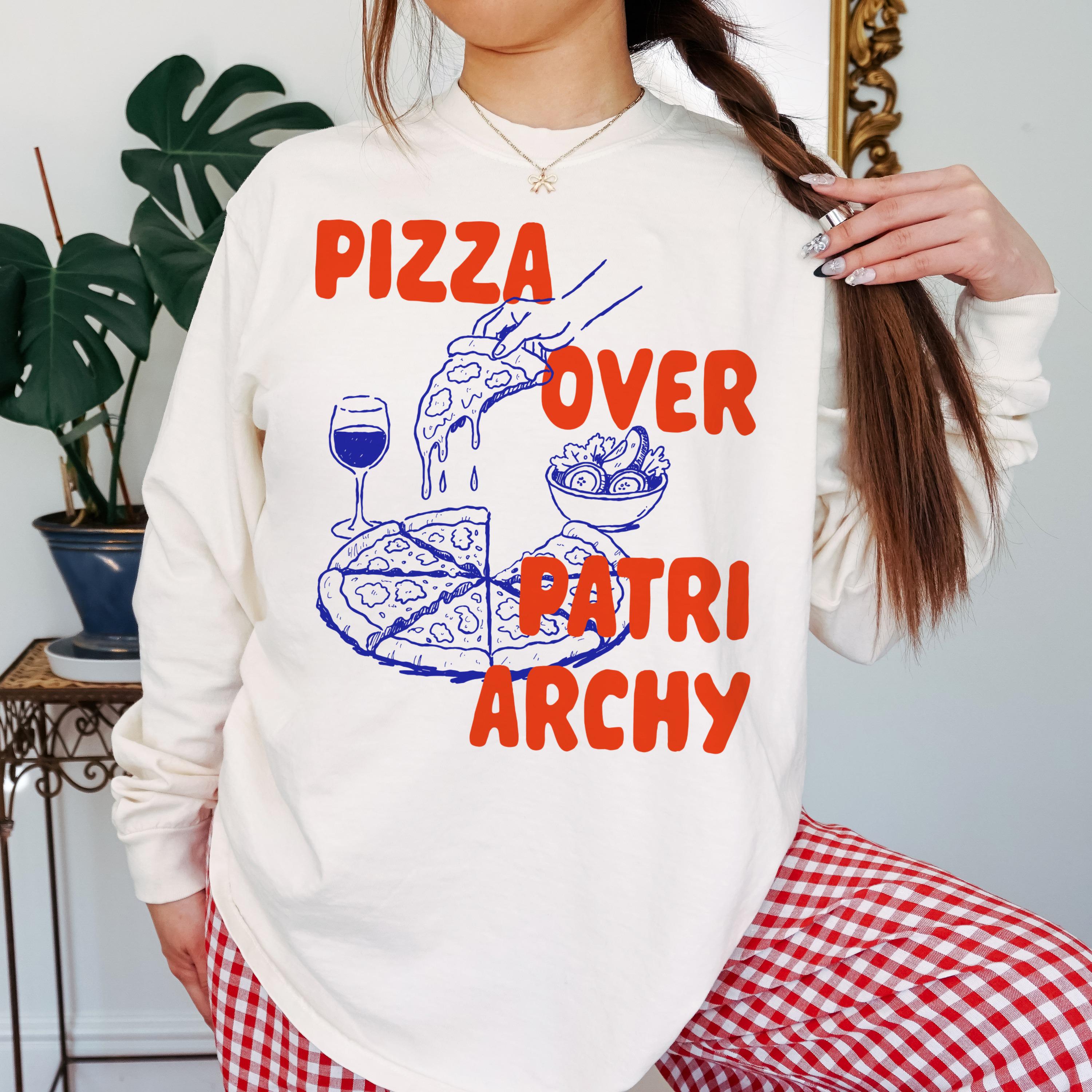 Cream long-sleeve shirt with blue and red text and graphic of pizza.
