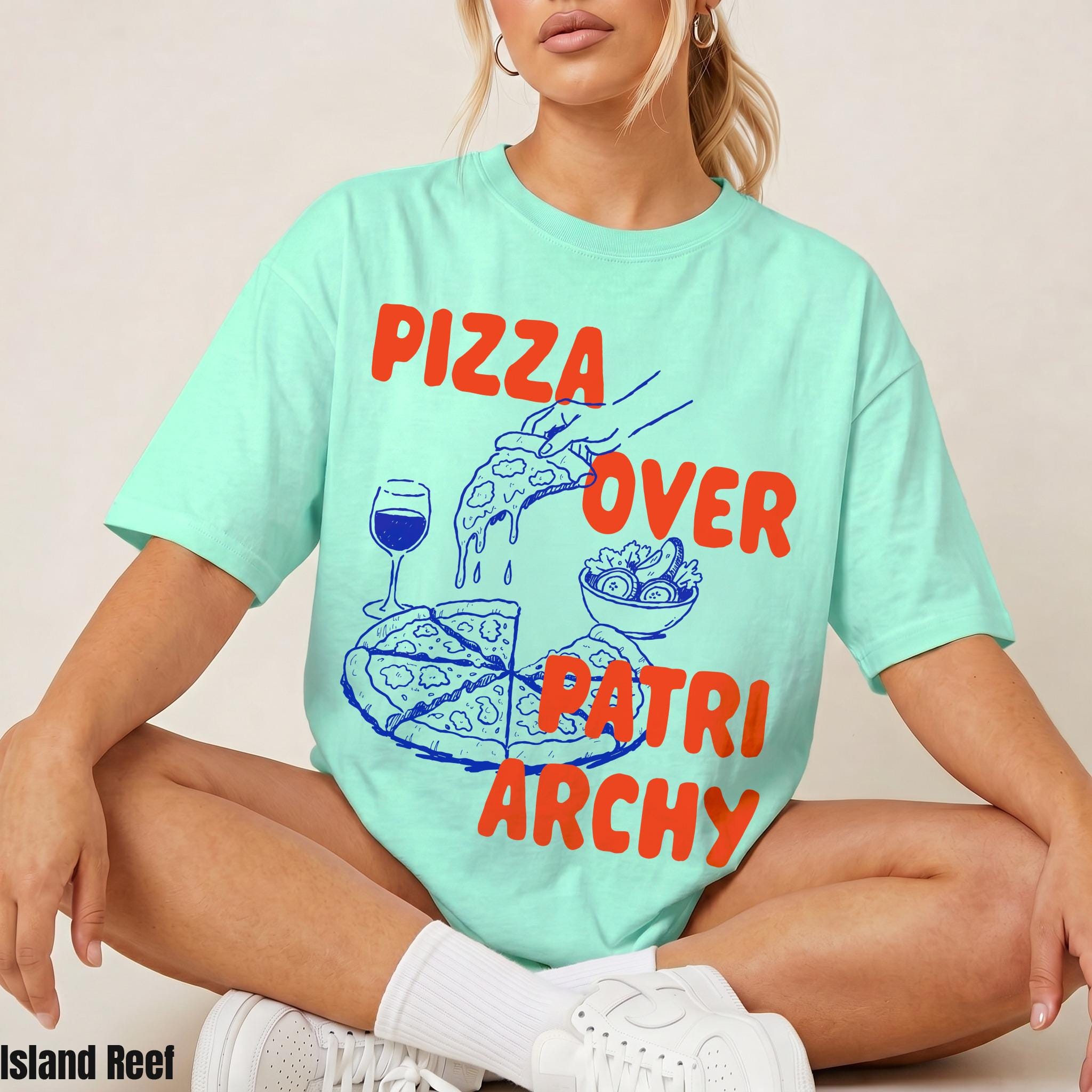 Mint green t-shirt with &amp;quot;PIZZA OVER PATRIARCHY&amp;quot; text and pizza graphic.