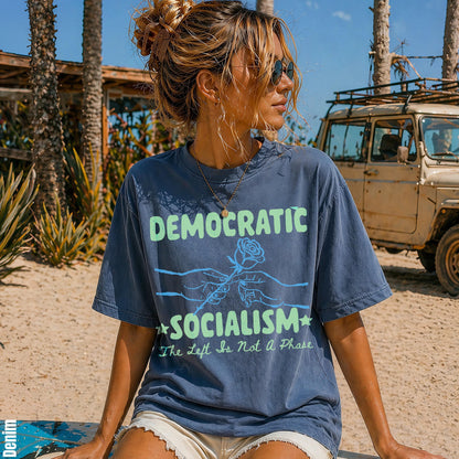 Blue t-shirt with text &amp;quot;DEMOCRATIC SOCIALISM The Left Is Not A Phase&amp;quot; and graphic of hands holding a rose.