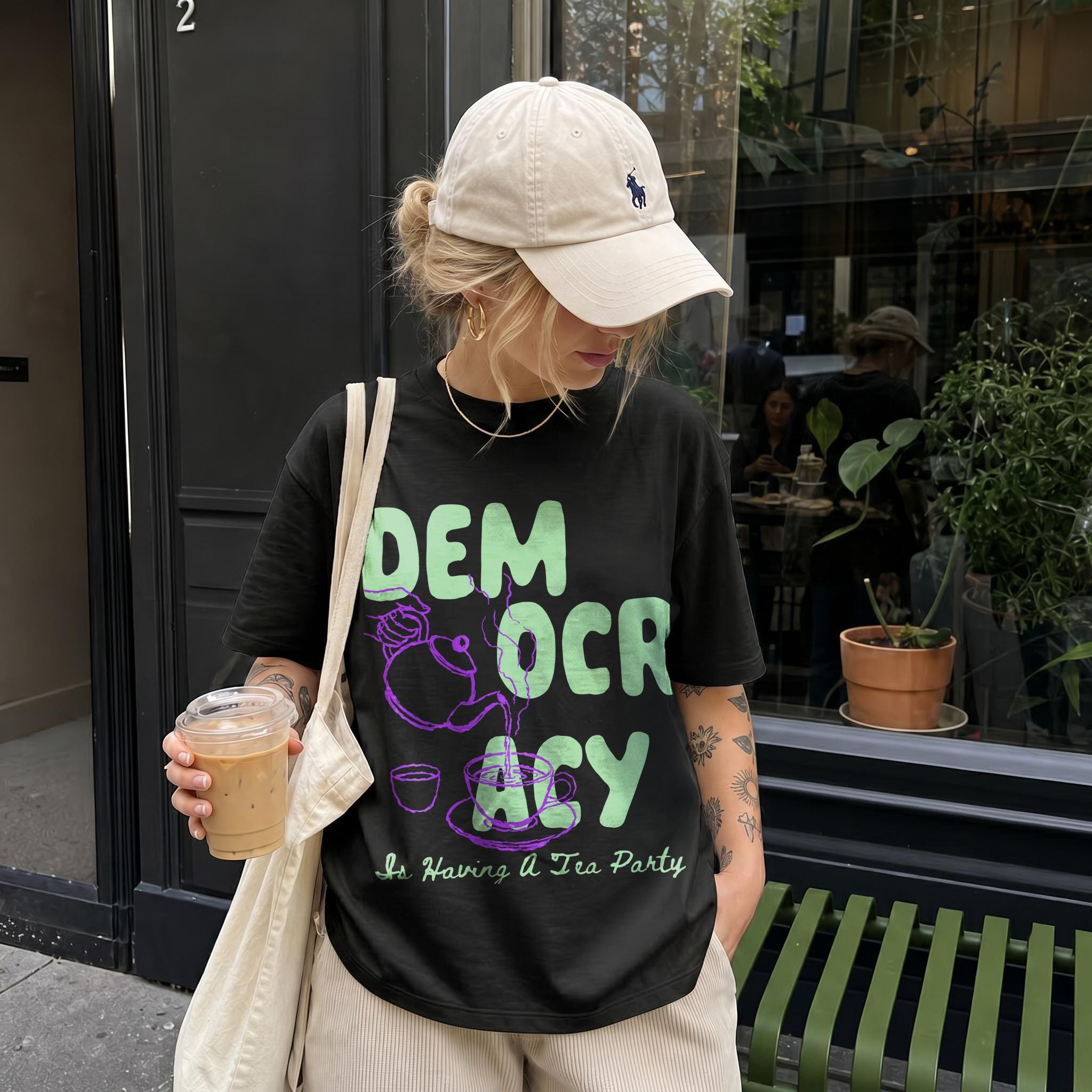 Black t-shirt with large light green &amp;quot;DEMOCRACY&amp;quot; text and tea party graphic.