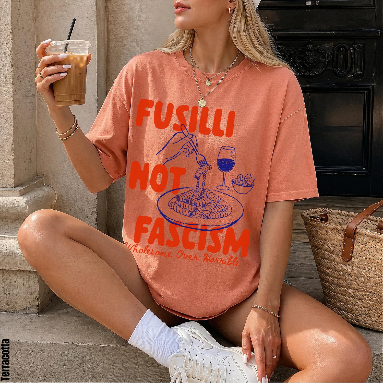 Coral t-shirt with &amp;quot;FUSILLI NOT FASCISM&amp;quot; text and pasta graphic. Wholesome.