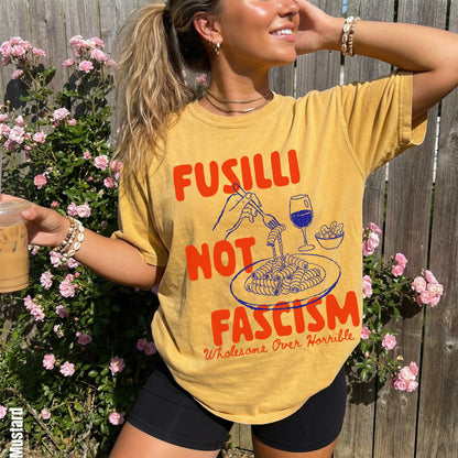 Yellow t-shirt with &amp;quot;Fusilli Not Fascism Wholesome Over Horrible&amp;quot; text and pasta graphic.