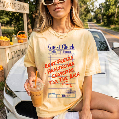 Yellow t-shirt with &amp;quot;Guest Check&amp;quot; graphic listing &amp;quot;Rent Freeze Healthcare Ceasefire Tax The Rich.&amp;quot;