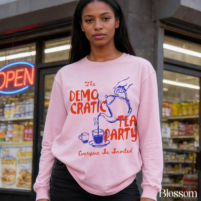 Pink sweatshirt with red text reading &amp;quot;The Democratic Tea Party Everyone Is Invited&amp;quot;.