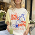 T-shirt with "The Democratic Tea Party" graphic and "Everyone Is Invited" text.