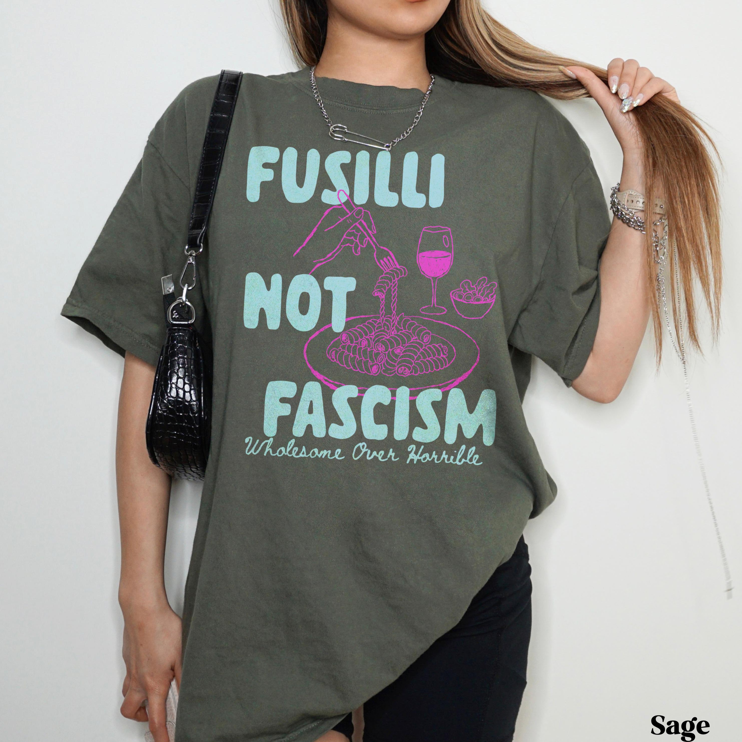 Olive green t-shirt with &amp;quot;Fusilli Not Fascism Wholesome Over Horrible&amp;quot; text and pasta graphic.