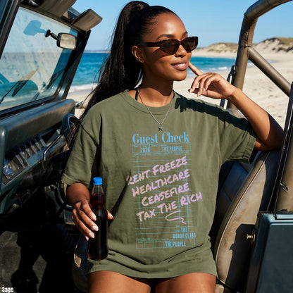 Olive green t-shirt with &amp;quot;Guest Check&amp;quot; graphic listing &amp;quot;Rent Freeze, Healthcare, Ceasefire, Tax The Rich.&amp;quot;