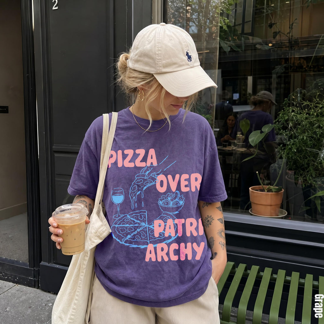 Purple t-shirt with &amp;quot;Pizza Over Patriarchy&amp;quot; graphic and a hand holding coffee.