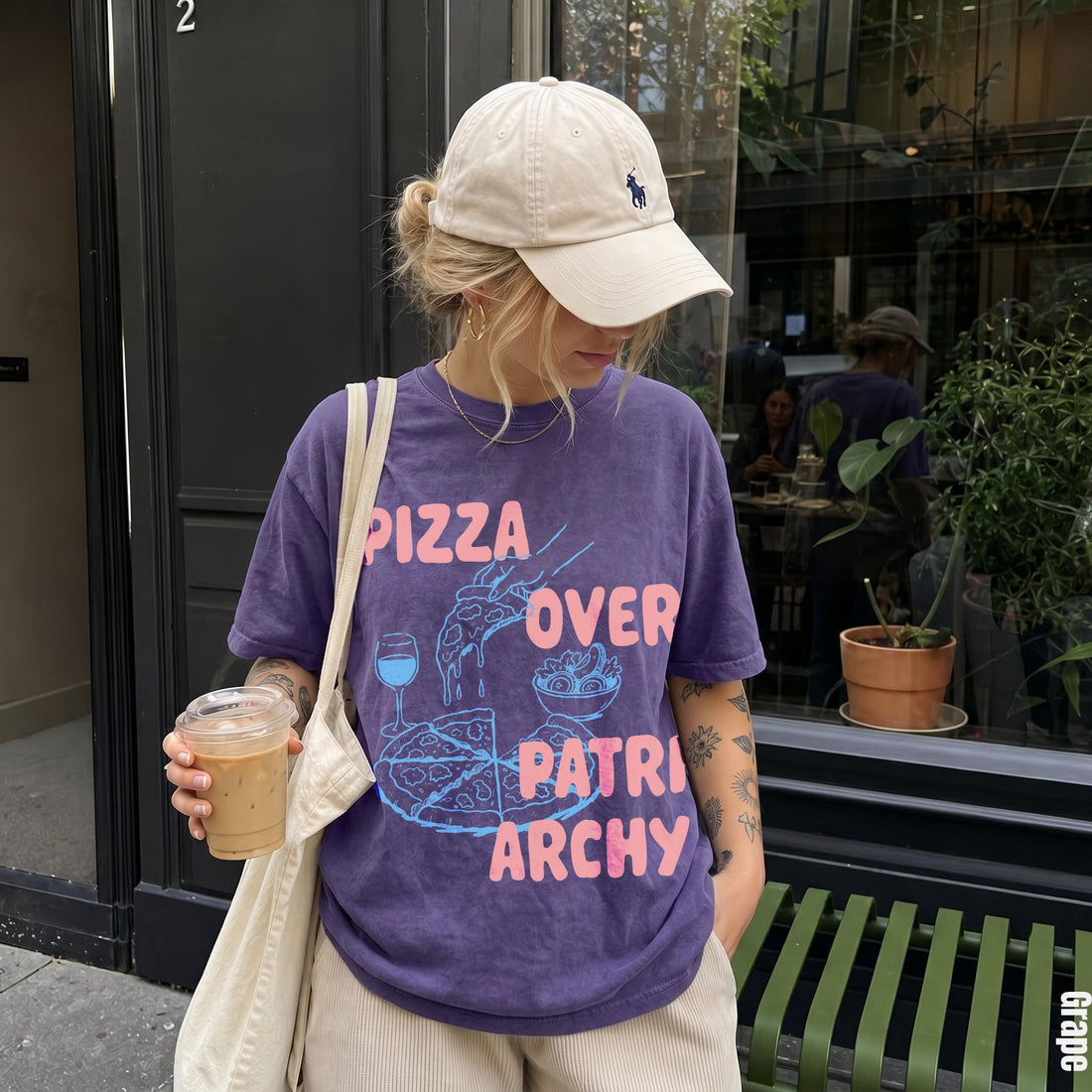 Purple t-shirt with &amp;quot;Pizza Over Patriarchy&amp;quot; graphic and a hand holding coffee.