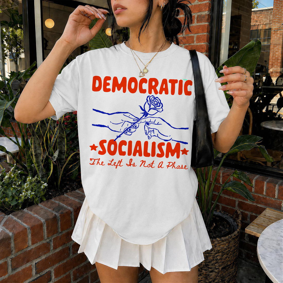 White t-shirt with red and blue &amp;quot;Democratic Socialism&amp;quot; graphic and rose.