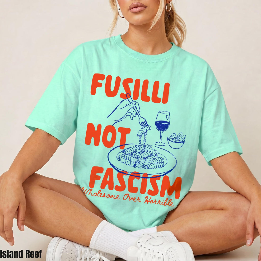 Mint green t-shirt with &amp;quot;Fusilli Not Fascism Wholesome Over Horrible&amp;quot; text and pasta graphic.