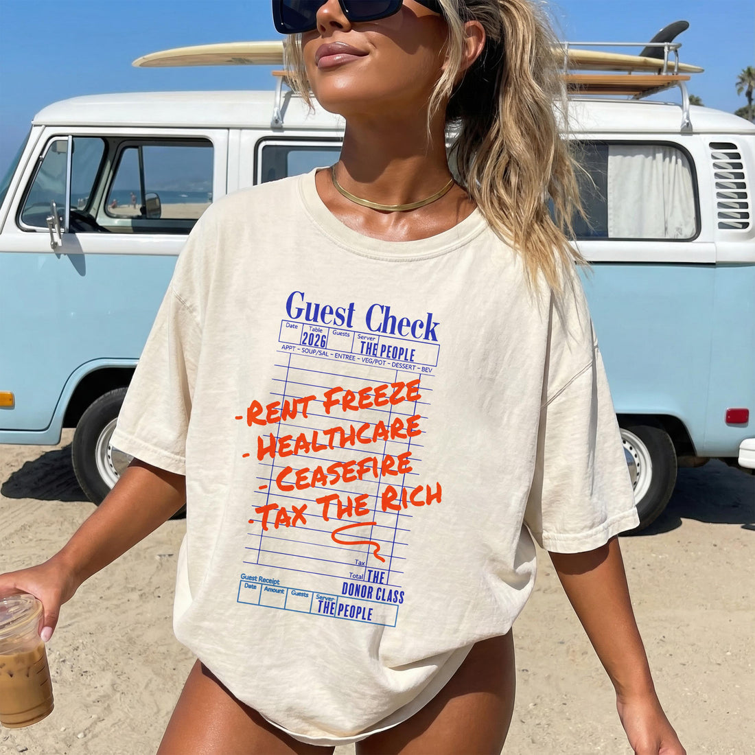 Guest Check shirt with &amp;quot;Rent Freeze&amp;quot;, &amp;quot;Healthcare&amp;quot;, &amp;quot;Ceasefire&amp;quot;, &amp;quot;Tax The Rich&amp;quot; text, beach setting.