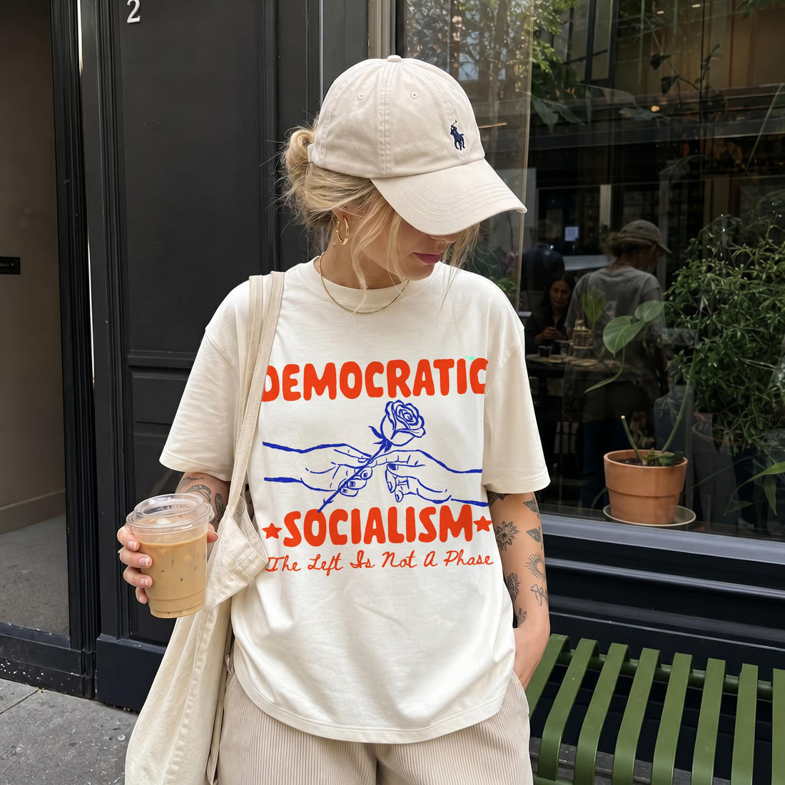 Cream t-shirt with red &amp;quot;DEMOCRATIC SOCIALISM&amp;quot; text, a rose, and &amp;quot;The Left Is Not A Phase&amp;quot;.