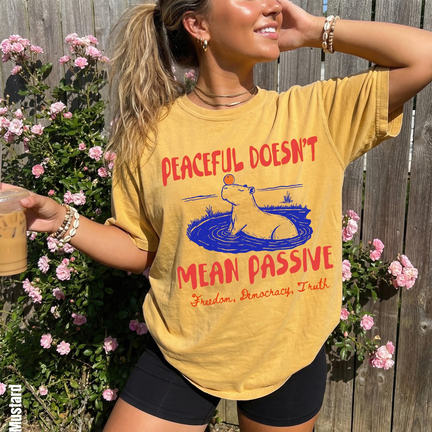 Yellow t-shirt with graphic text &amp;quot;Peaceful Doesn&amp;