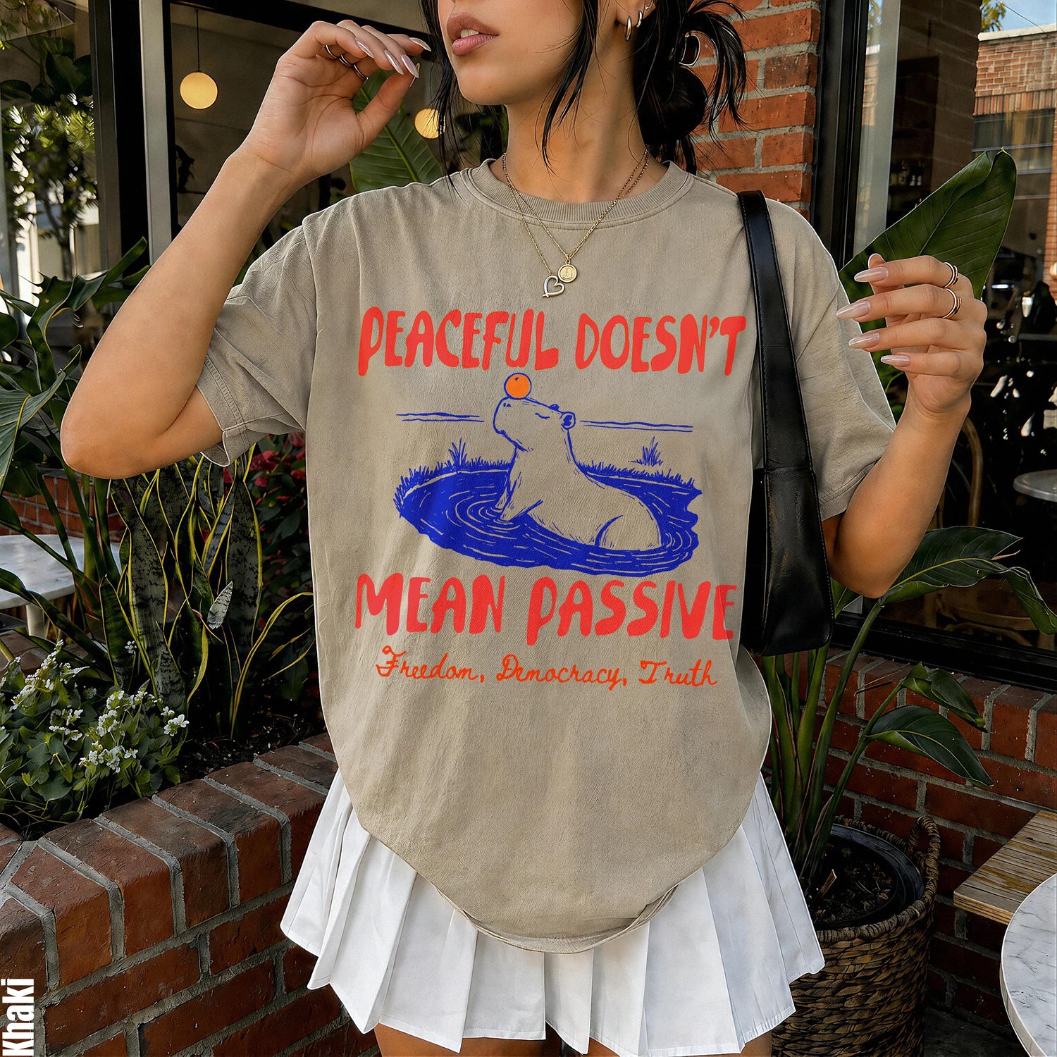 T-shirt with text &amp;quot;Peaceful Doesn&amp;