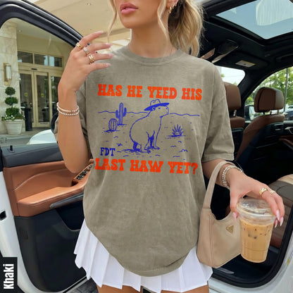 T-shirt with capybara in cowboy hat, cactus, and desert scene, text &amp;quot;HAS HE YEED HIS FDT LAST HAW YET?&amp;quot;