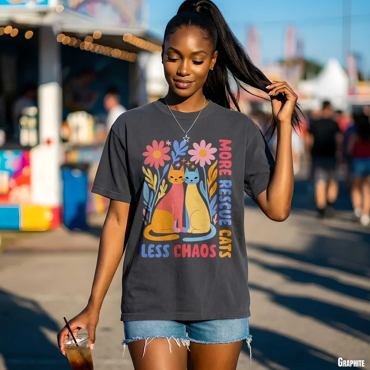 Graphic tee with floral cat illustration and text: &amp;quot;More Rescue Cats, Less Chaos.&amp;quot;