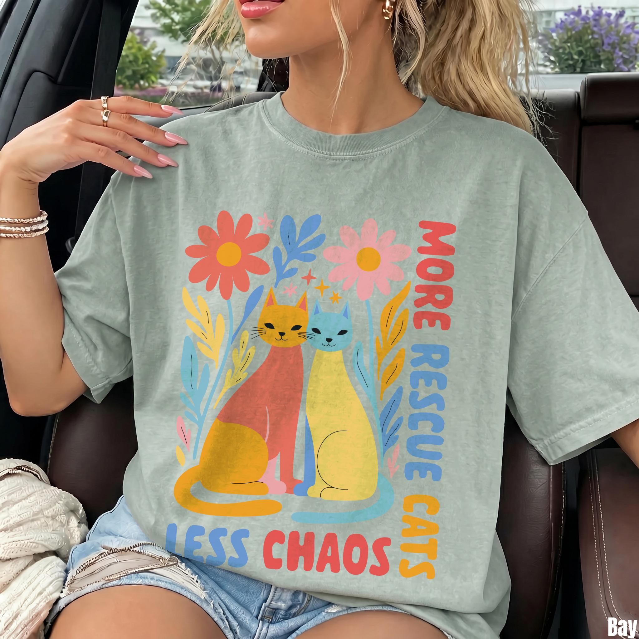 Two cats, &amp;quot;More Rescue Cats, Less Chaos&amp;quot; text, floral background on a t-shirt.