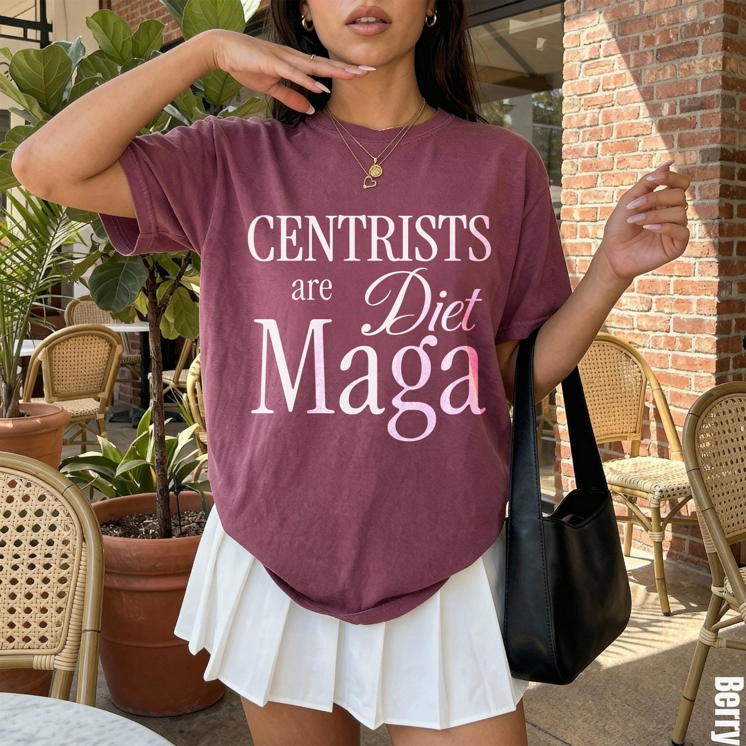 Berry t-shirt with &amp;quot;CENTURISTS are Diet Maga&amp;quot; text, paired with a white pleated skirt.