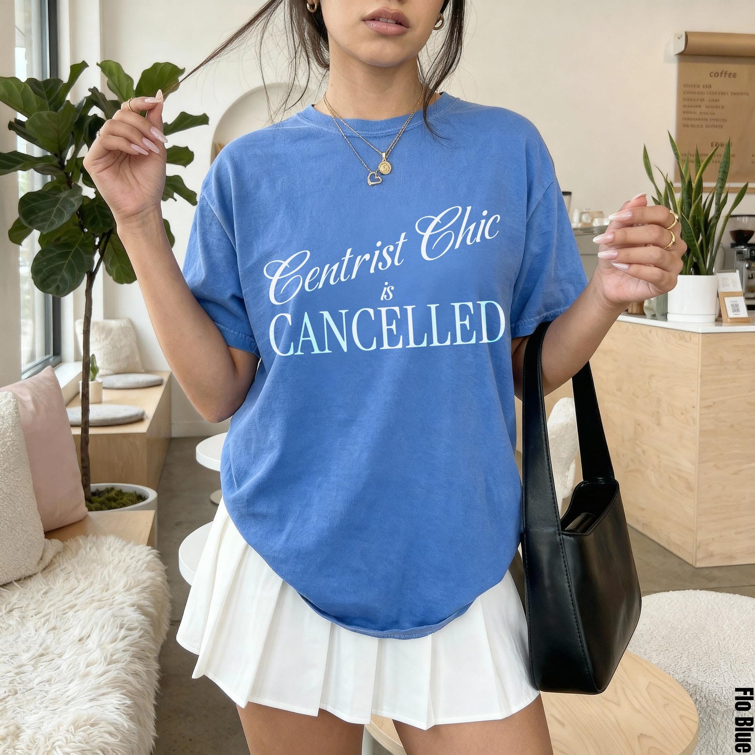 Blue t-shirt with &amp;quot;Centrist Chic is CANCELLED&amp;quot; text, worn by a woman.