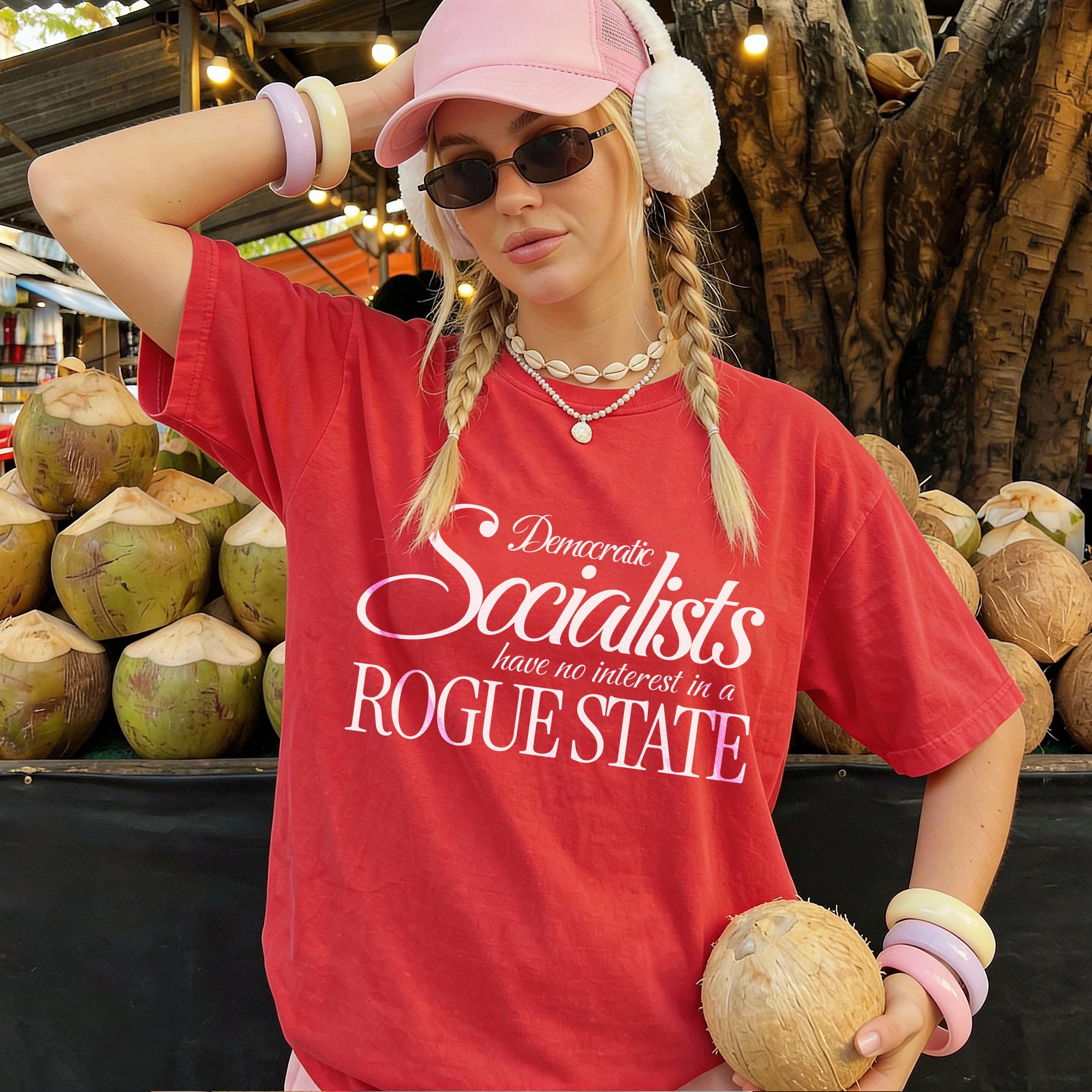 Red t-shirt with &amp;quot;Democratic Socialists have no interest in a ROGUE STATE&amp;quot; text, holding coconut.