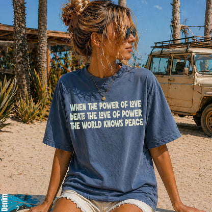 Denim t-shirt with text &amp;quot;When the power of love beats the love of power the world knows peace.&amp;quot;