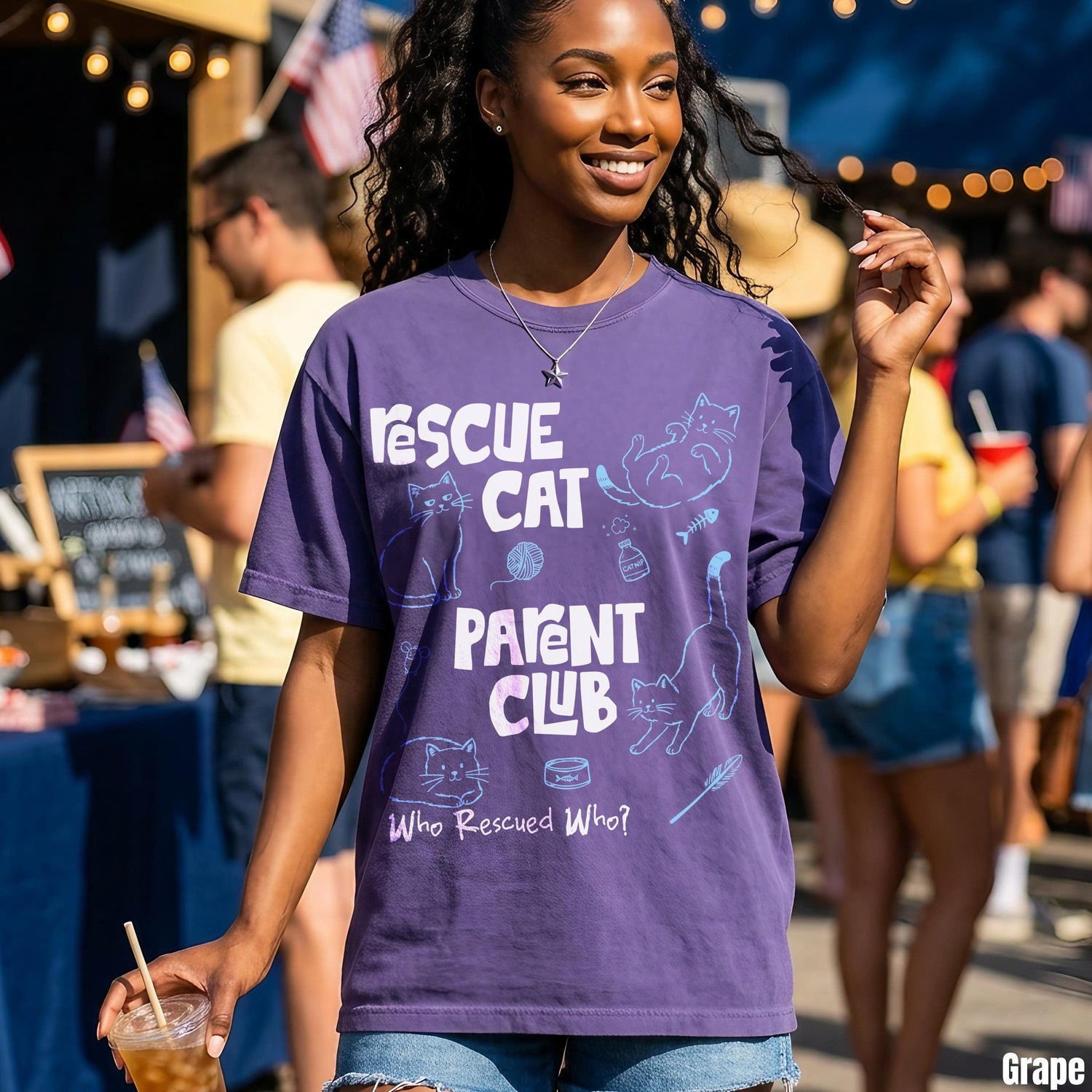 Purple t-shirt with &amp;quot;Rescue Cat Parent Club&amp;quot; text and cat graphics.