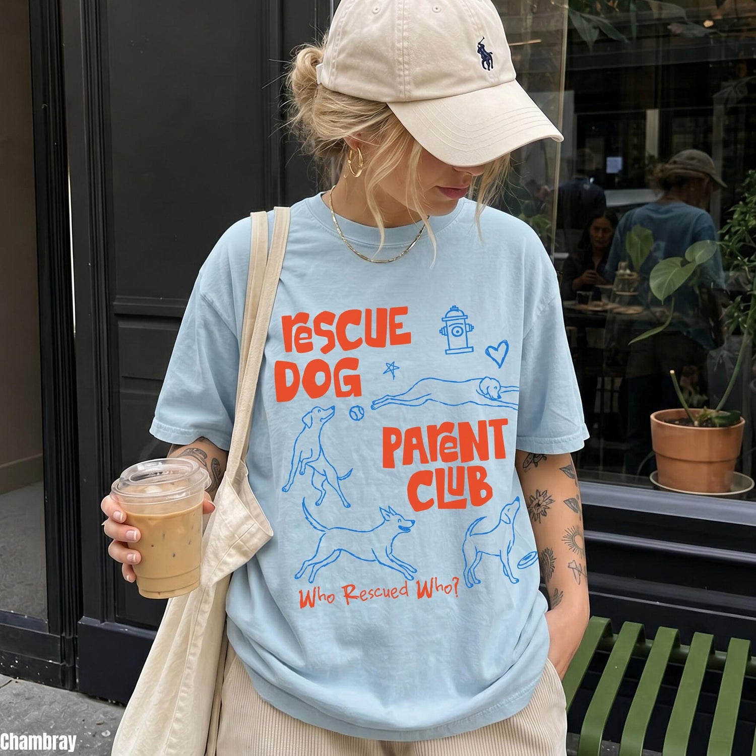 Light blue t-shirt with &amp;quot;Rescue Dog Parent Club&amp;quot; graphic and dog illustrations.