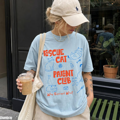 Light blue t-shirt with &amp;quot;Rescue Cat Parent Club&amp;quot; text and cat illustrations.