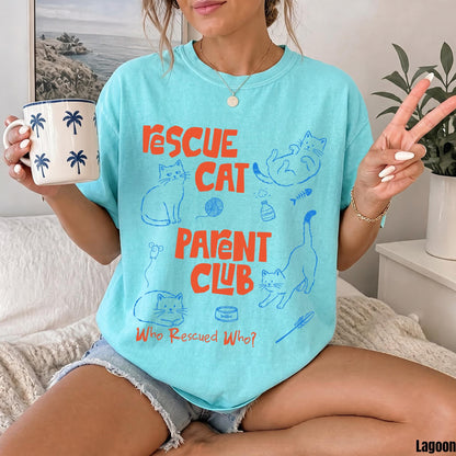 Turquoise t-shirt with &amp;quot;Rescue Cat Parent Club&amp;quot; text and line drawings of cats and fishbones.
