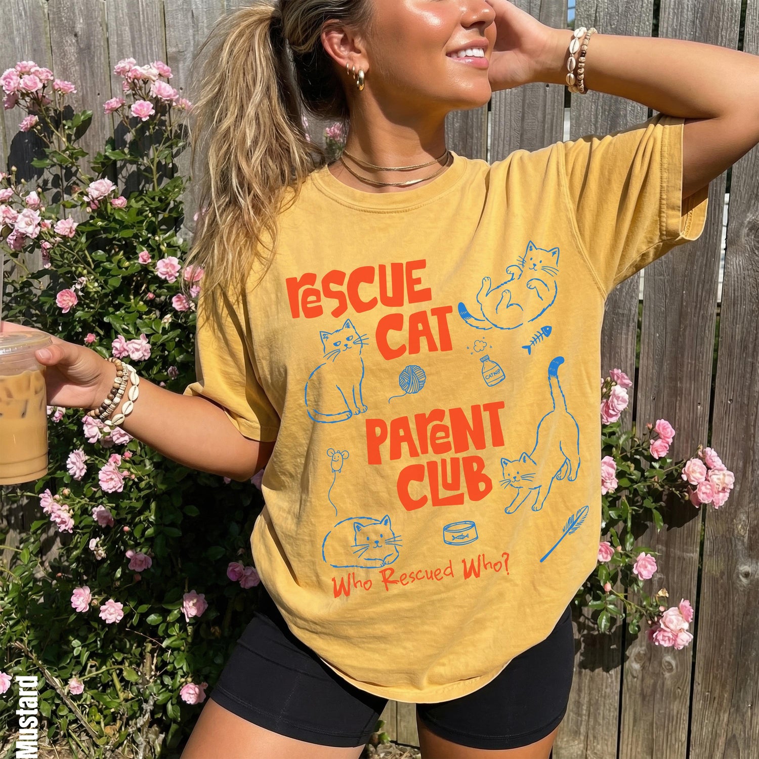 Yellow t-shirt with &amp;quot;Rescue Cat Parent Club&amp;quot; text and cat illustrations.