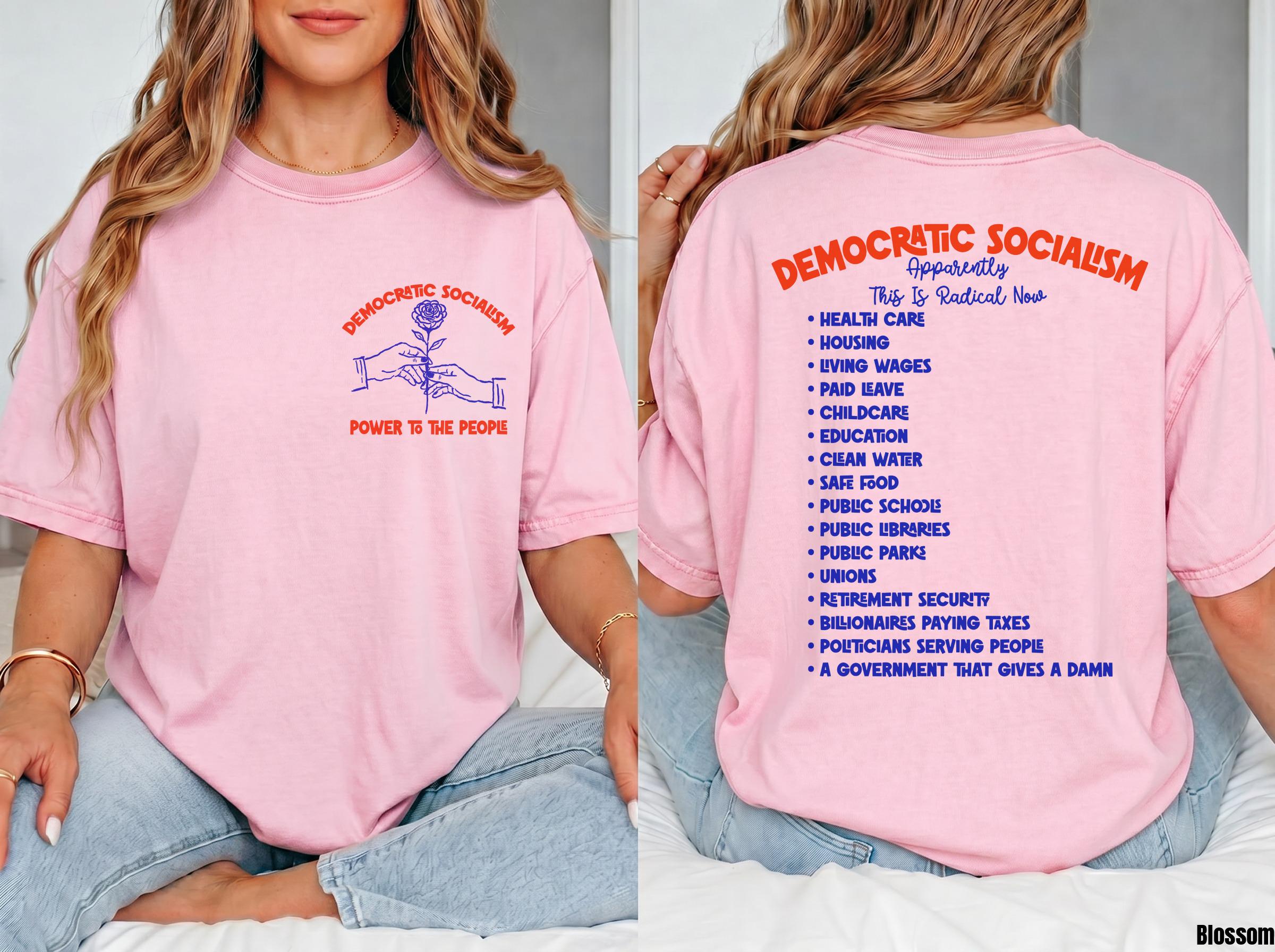 Pink t-shirt with &amp;quot;Democratic Socialism&amp;quot; graphic and list of social programs on back.