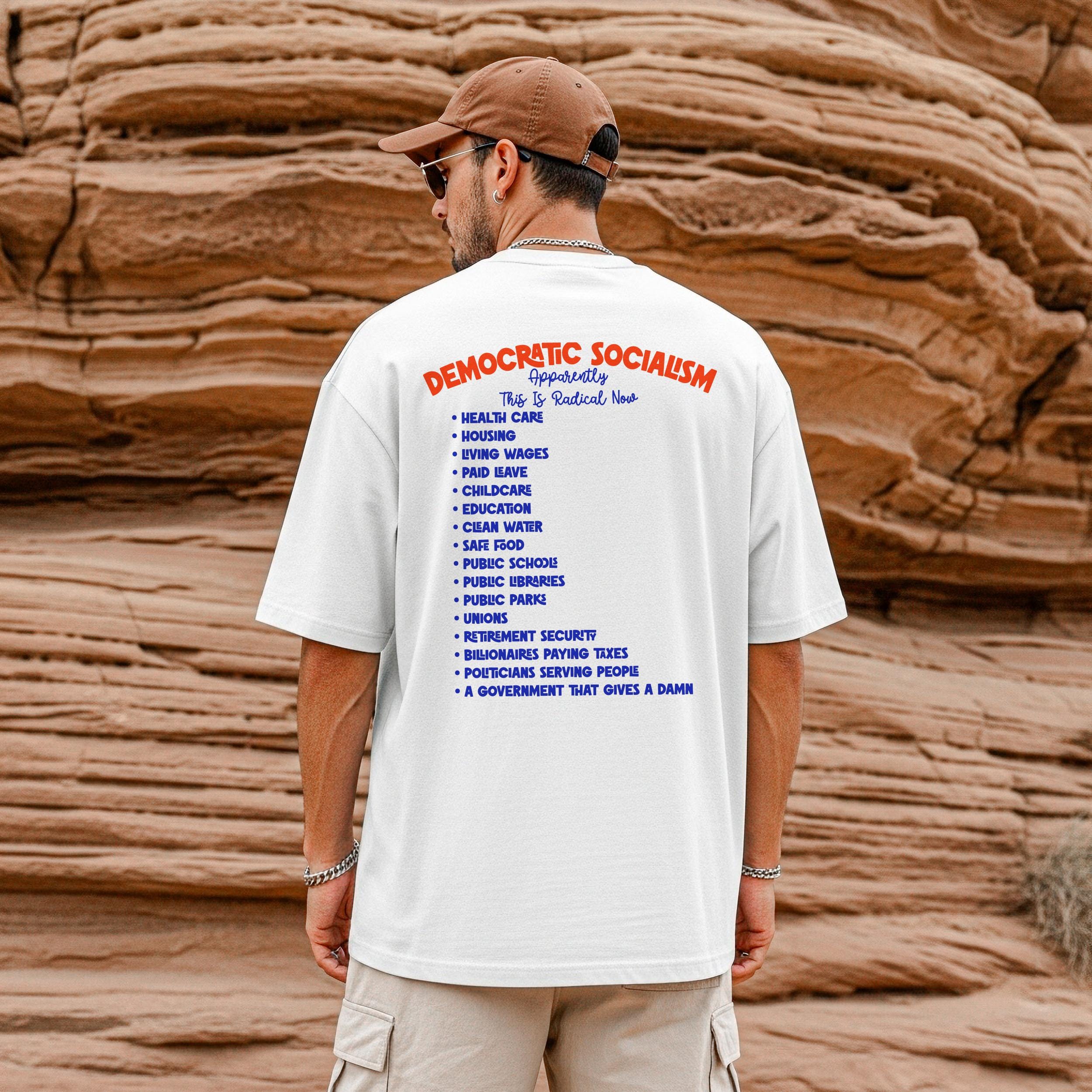 White t-shirt with text listing social programs associated with democratic socialism.