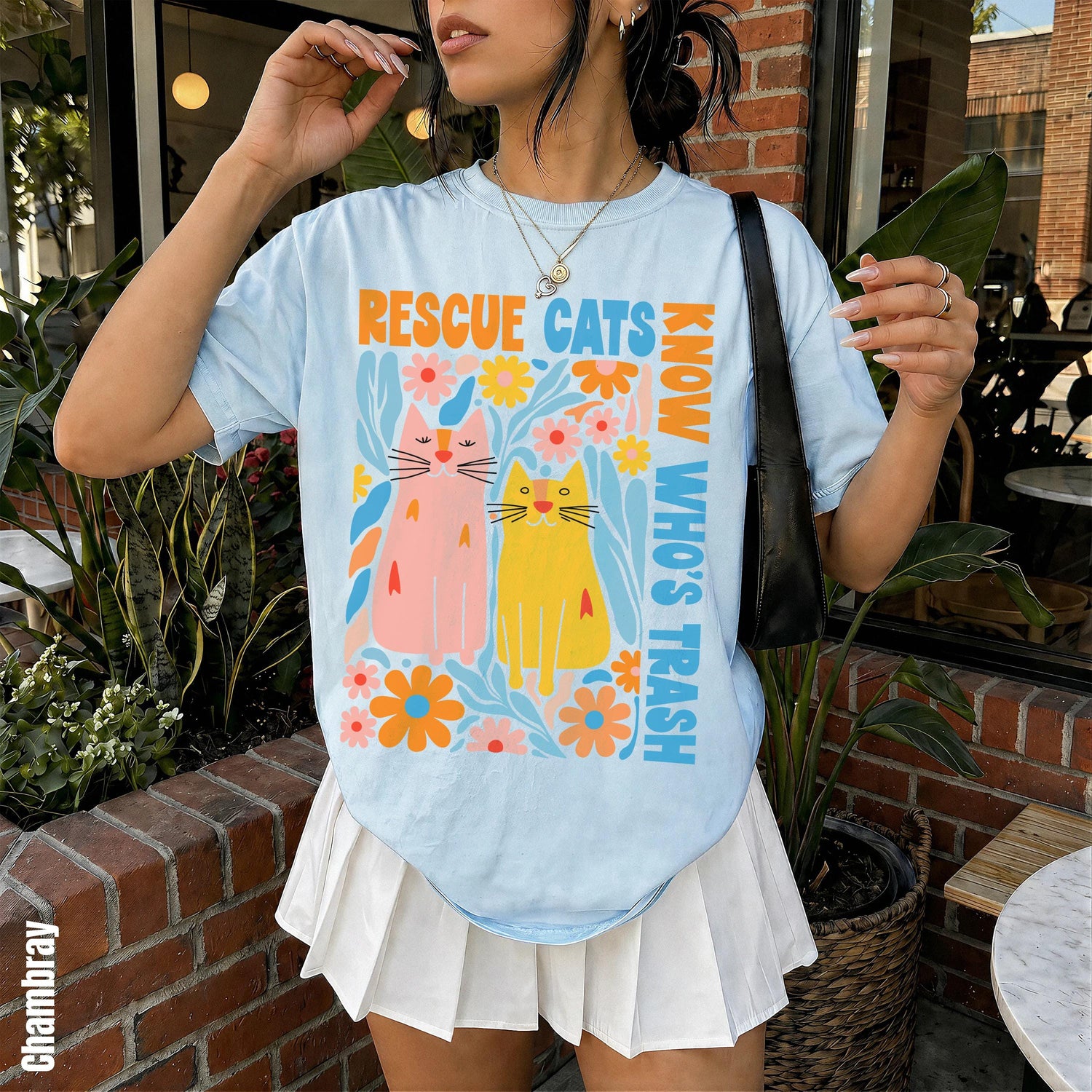 Light blue t-shirt with colorful &amp;quot;Rescue Cats Know Who&amp;