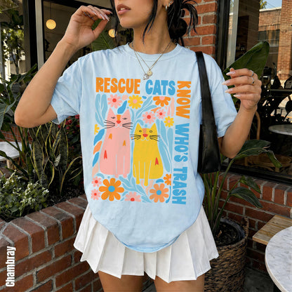 Light blue t-shirt with colorful &amp;quot;Rescue Cats Know Who&amp;