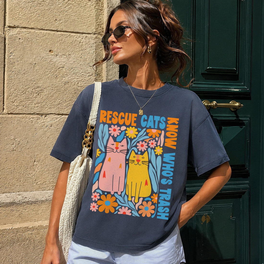 Dark t-shirt with colorful cat and flower graphic, text reads &amp;quot;Know Who&amp;