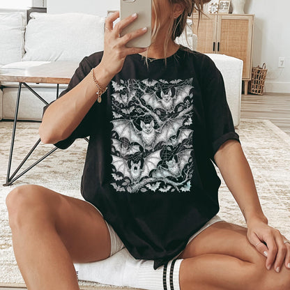 Black t-shirt featuring a detailed monochrome illustration of numerous bats clinging to branches.