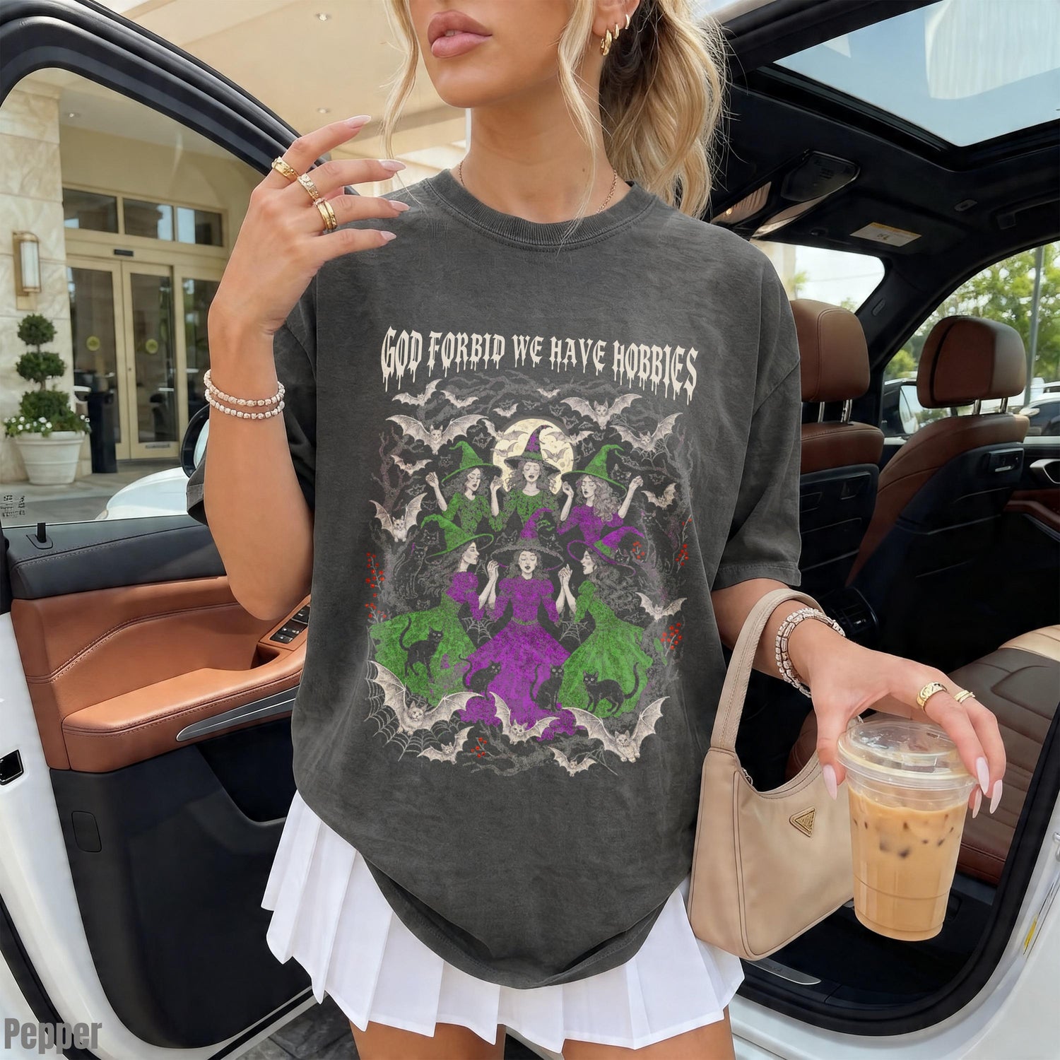 Graphic tee with three witches and bats, text &amp;quot;GOD FORBID WE HAVE HOBBIES.&amp;quot;