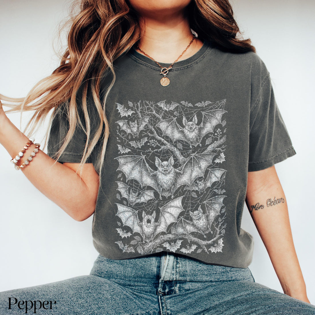 Dark grey t-shirt with all-over detailed bat and web print.