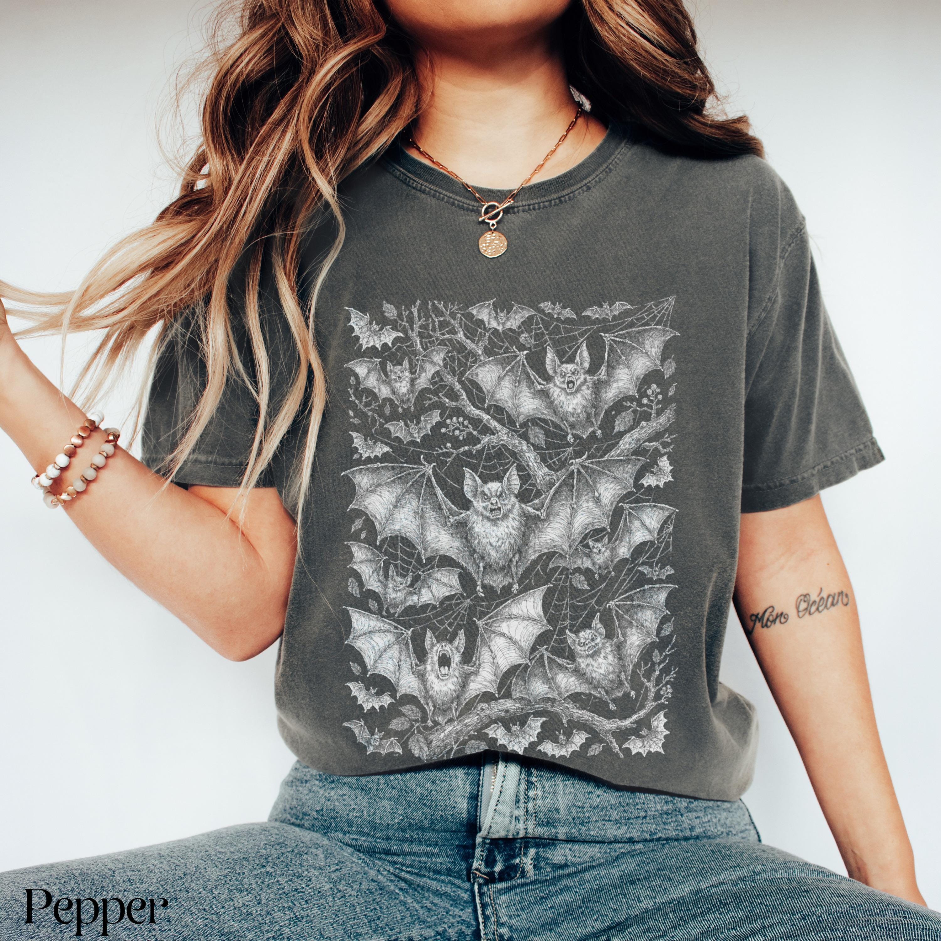 Dark grey t-shirt with all-over detailed bat and web print.