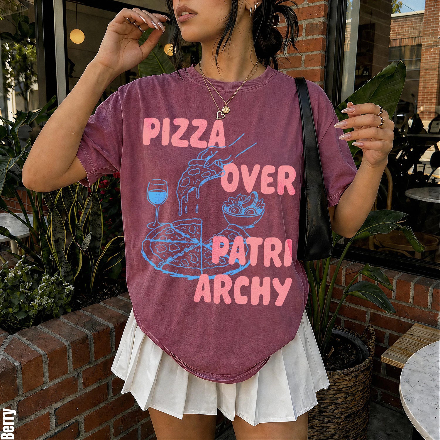 Berry t-shirt with &amp;quot;Pizza Over Patriarchy&amp;quot; graphic, pizza, wine, and salad.