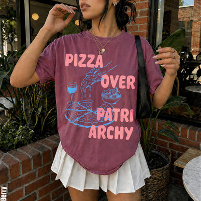 Berry t-shirt with &amp;quot;Pizza Over Patriarchy&amp;quot; graphic, pizza, wine, and salad.
