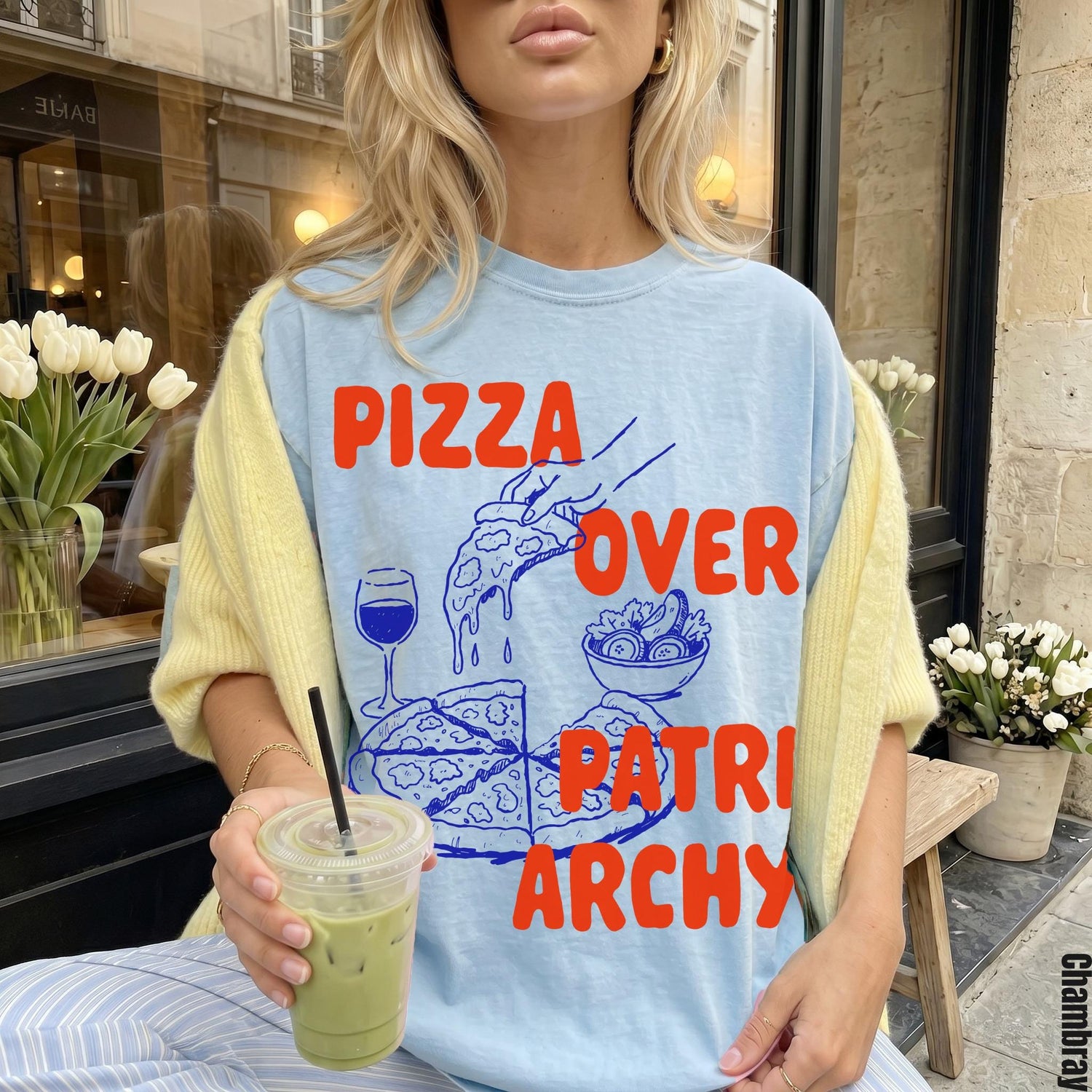 Light blue t-shirt with &amp;quot;Pizza Over Patriarchy&amp;quot; graphic featuring pizza and salad.
