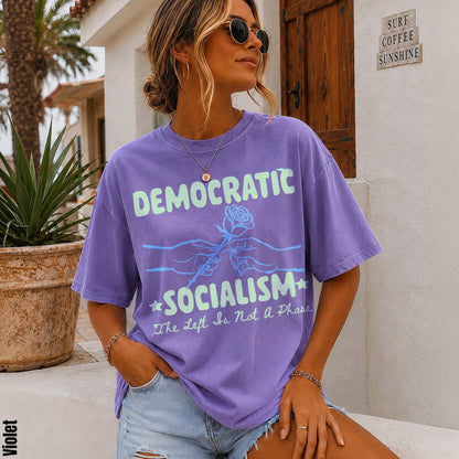Purple t-shirt with &amp;quot;DEMOCRATIC SOCIALISM The Left Is Not A Phase&amp;quot; text.